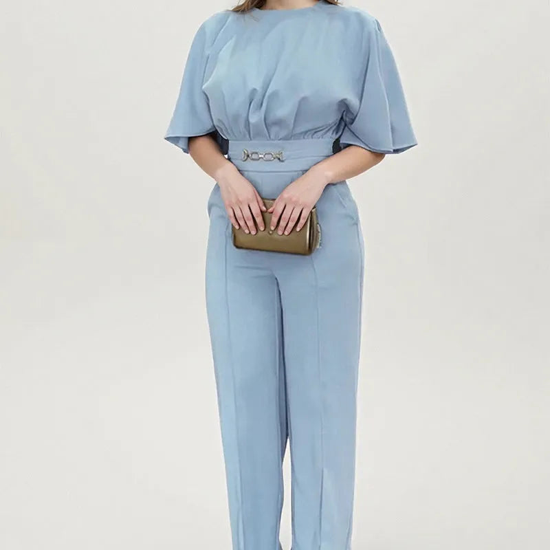 Men's blue two-piece casual suit with long-sleeved jacket and trousers on a hanger.