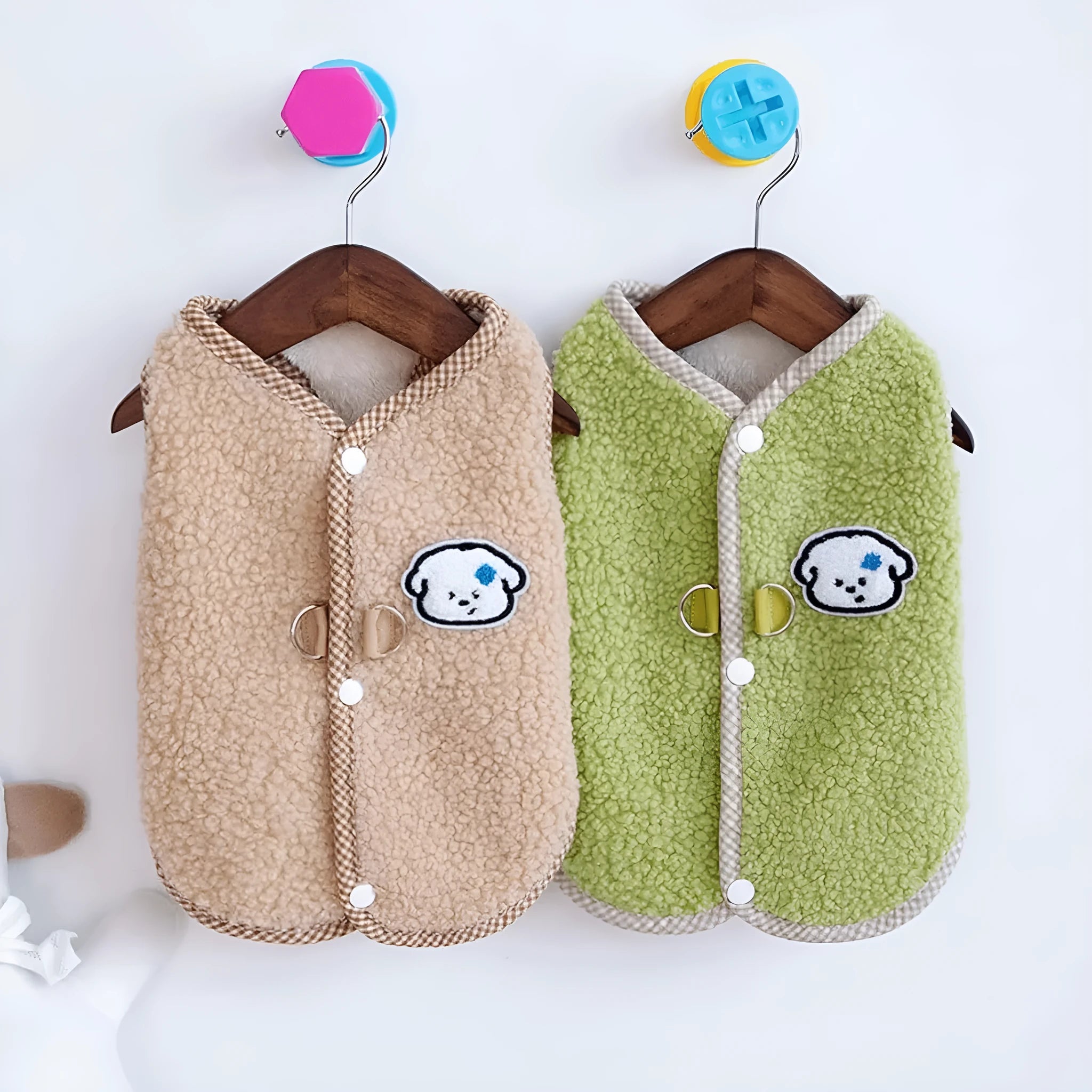 Green fleece dog vest with a metal leash ring on the back, for small pets.