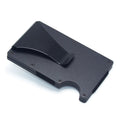 Geometric carbon fibre and aluminium business card holder, 8mm thick, on a table.