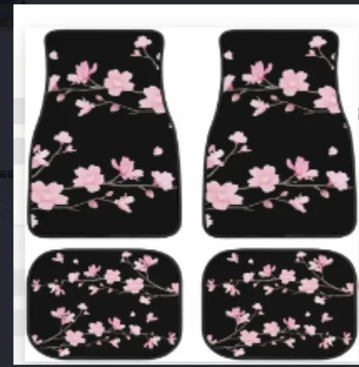 Black printed rubber car foot mat set showing textured surface and raised edges.