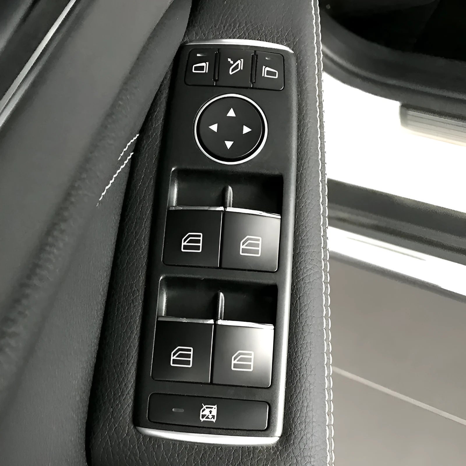 Black glitter decorative sticker for car window lift button panel on door.