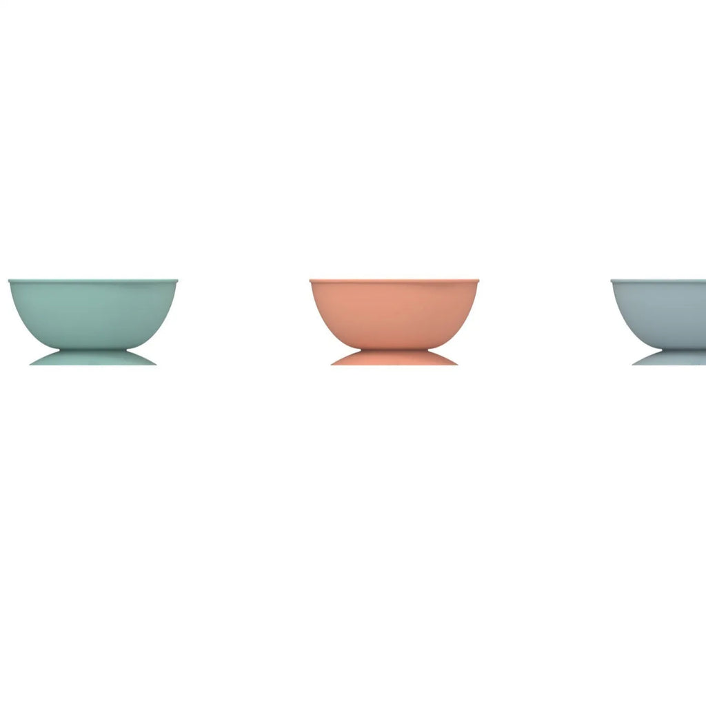 Cyan silicone pet licking mat bowl with suction cup base and textured feeding surface.