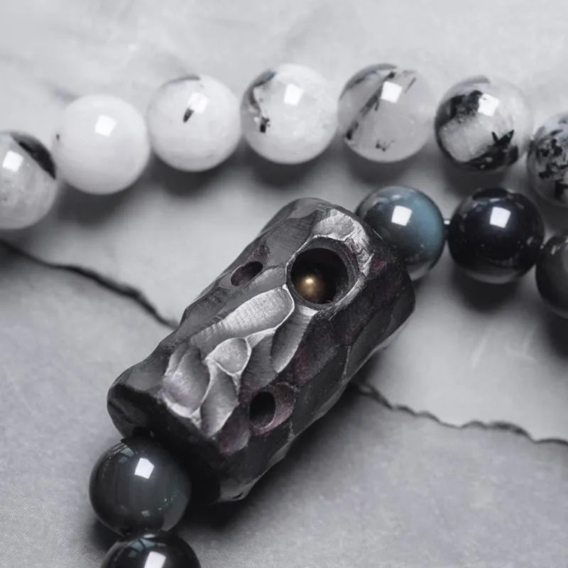 Ethnic style black hair crystal bracelet with white crystal tassel decoration showing bending and lacing construction