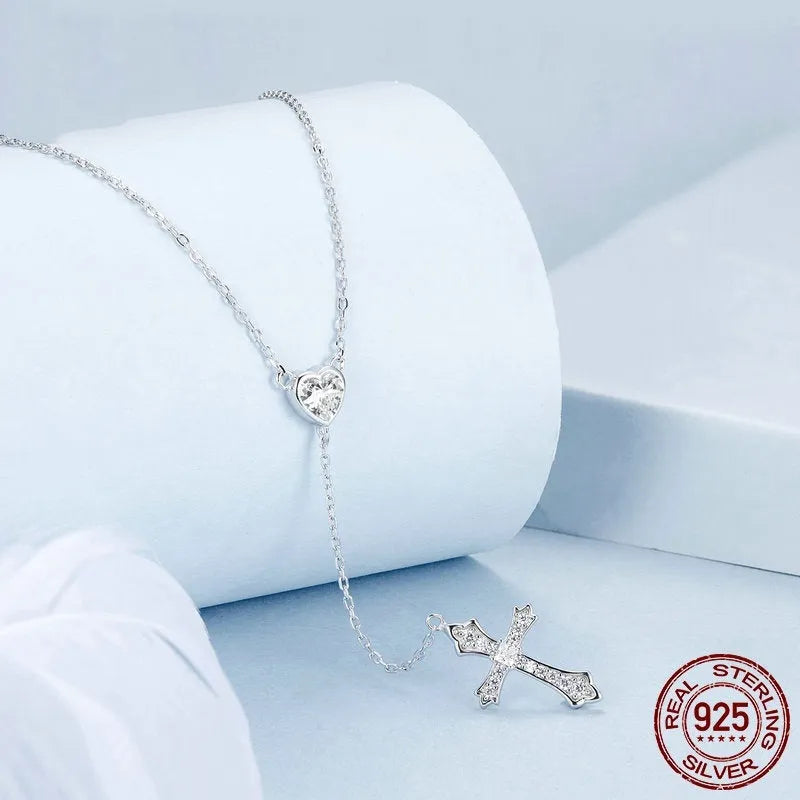Silver love cross necklace on an O-ring chain with a V-neck design, colour BSN384.