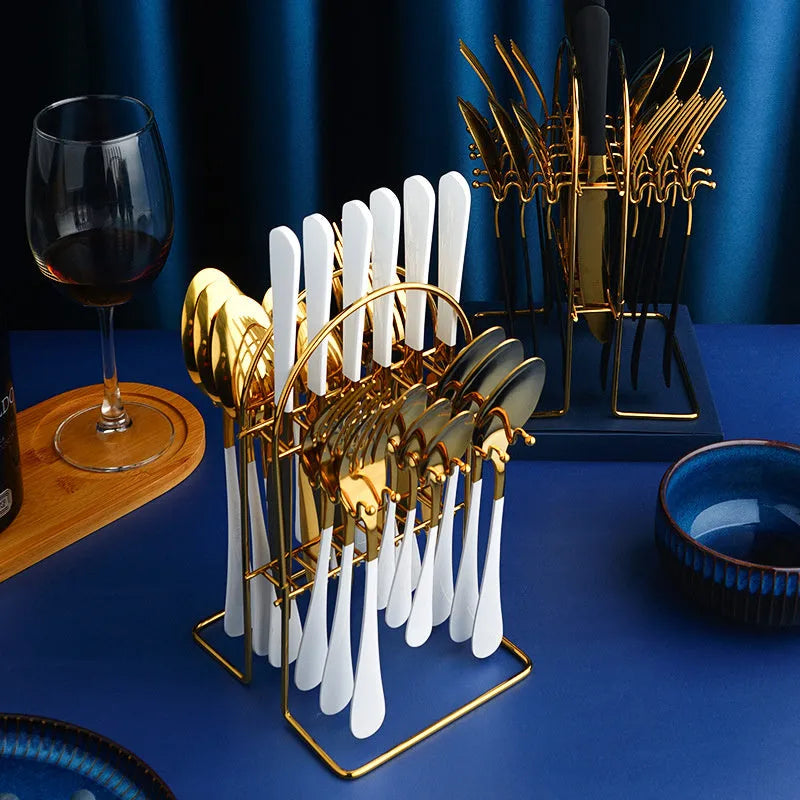 Gold stainless steel 24-piece cutlery set with storage rack containing knives, forks, spoons and teaspoons