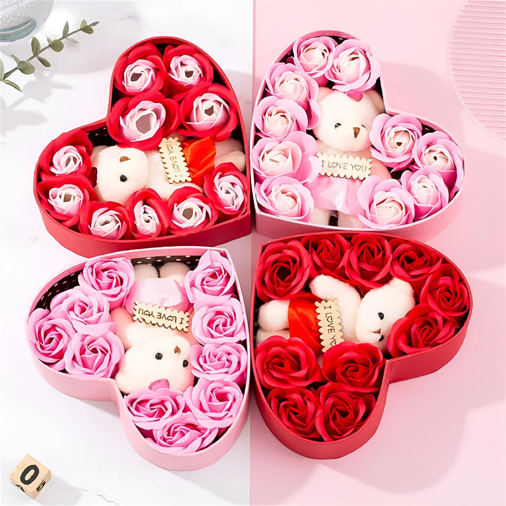 Red heart-shaped gift box open to show pink and red soap roses inside