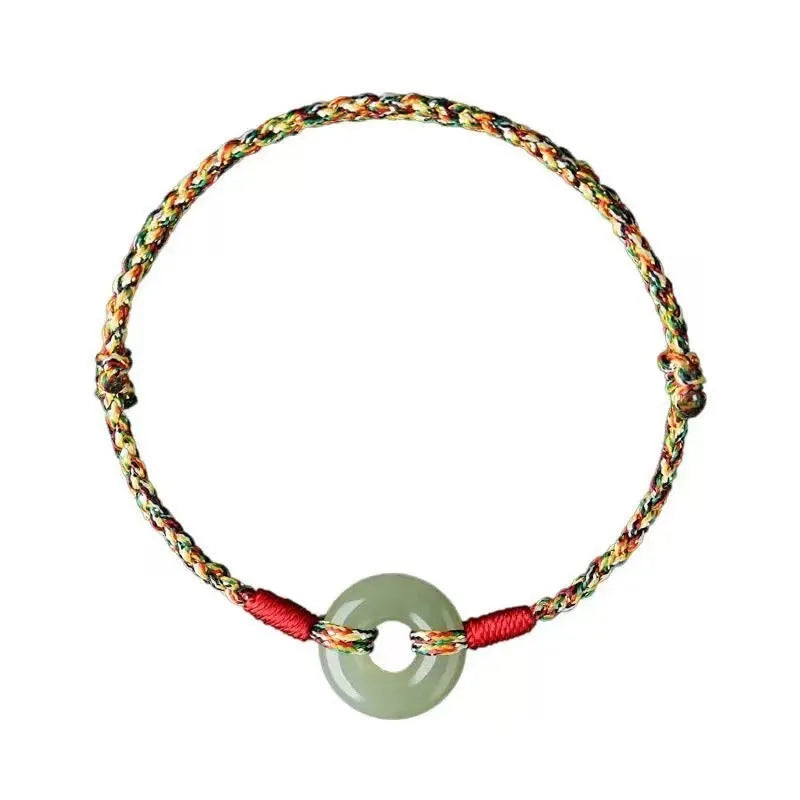 Colourful braided rope bracelet with peace buckle closure on woven design