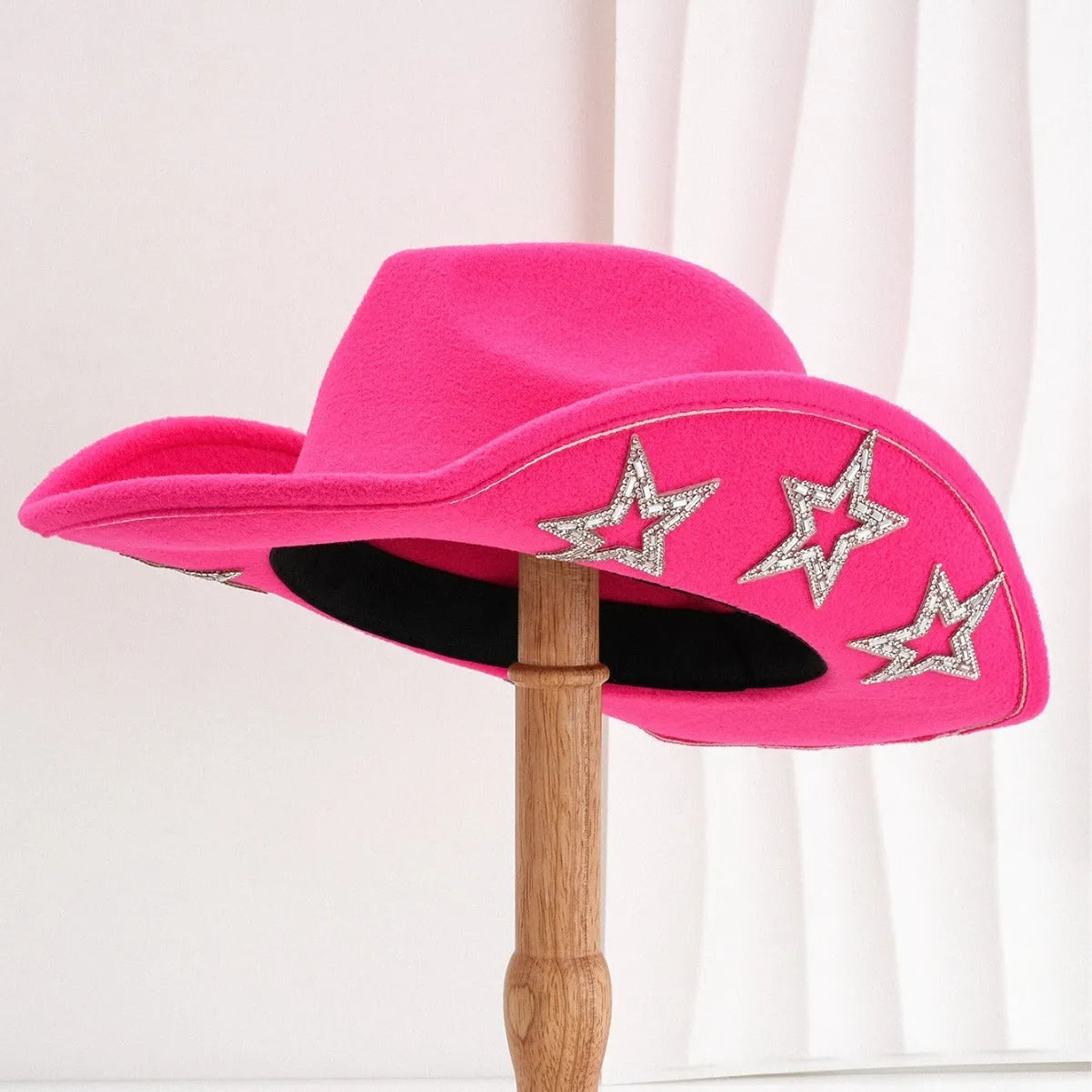 A beige woven polyester Western-style top hat with a conical crown and a hexagonal star detail on the front.