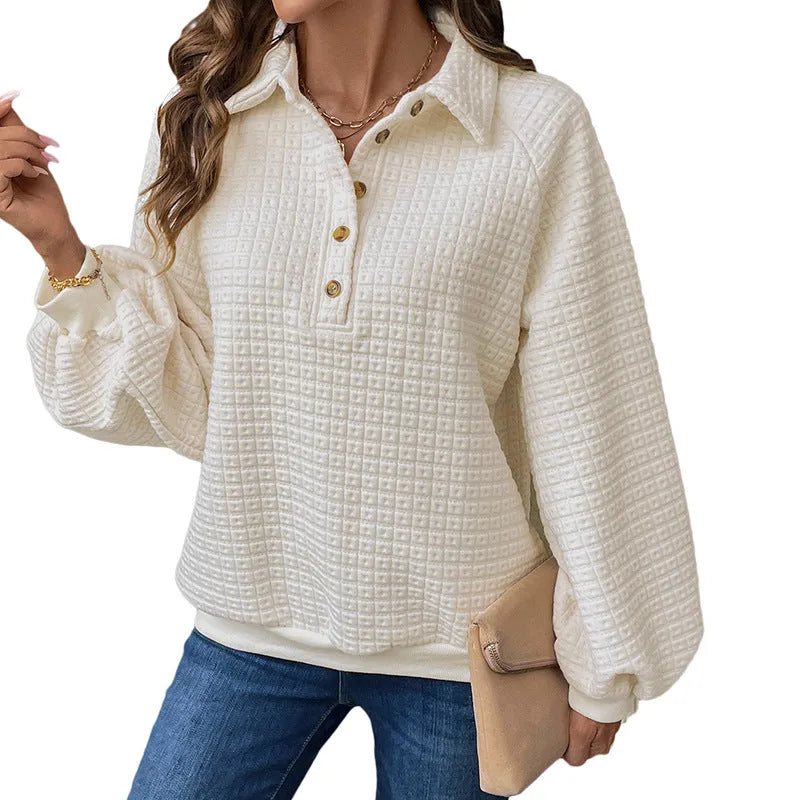 Beige women's polo collar sweater with long sleeves and a textured knit fabric.