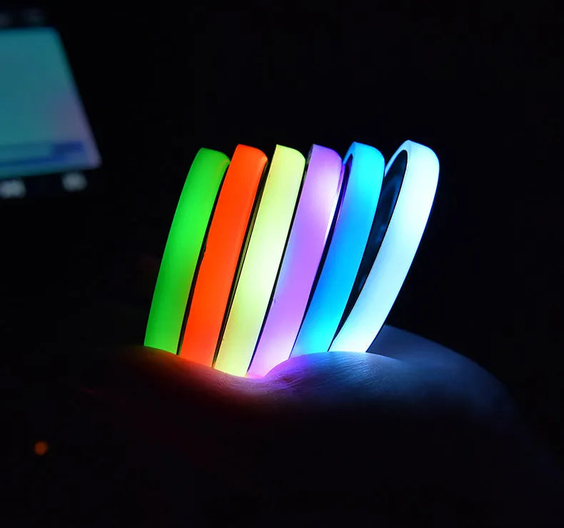 Colourful LED light-up coaster for car cup holder with seven colour options and USB cable.