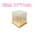 LED water ripple projection crystal table lamp with remote control on wooden surface