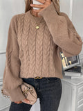 Women's beige casual sweater with a textured twist design and round neck.