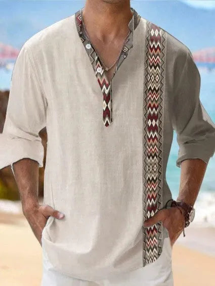 Man wearing a thin striped long sleeve casual shirt in a digital bamboo linen Hawaiian style.