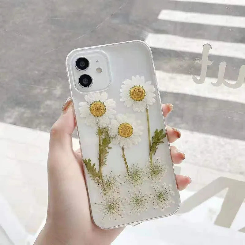 White clear epoxy daisy floral design TPU phone case for iPhone, shown from the back.