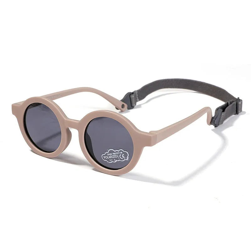 Children's silicone sunglasses with round full frame, UV400 polarised TAC lenses, and flexible TPEE construction for 0-3 year olds