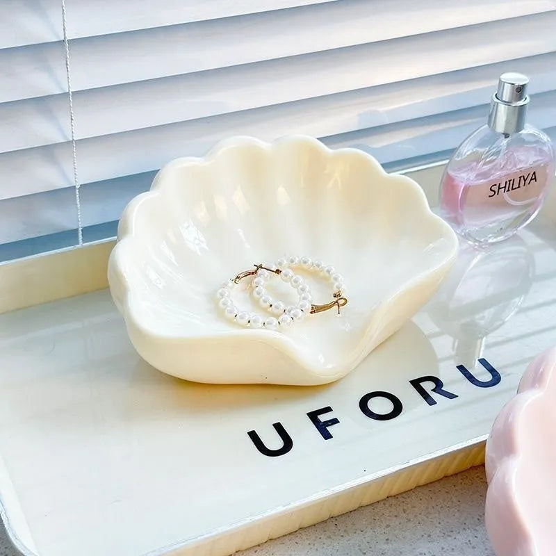 White and pink plastic shell-shaped soap dish for bathroom counter or shower