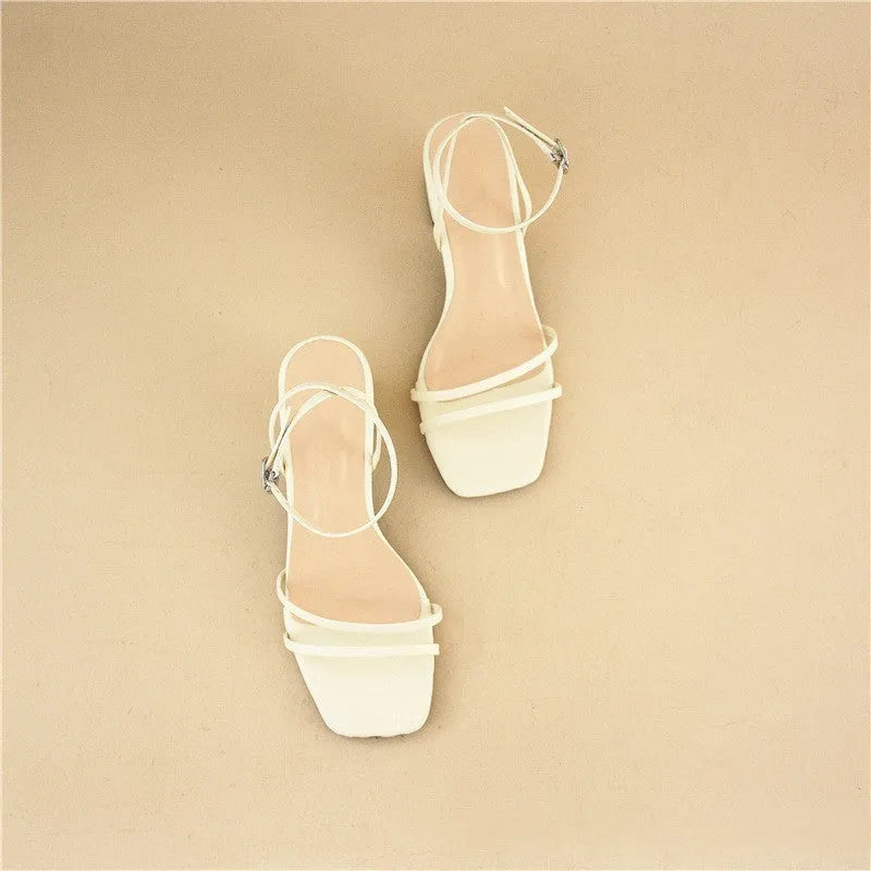 Beige women's stiletto sandals with chunky block heel and square toe design, showing adjustable ankle buckle closure