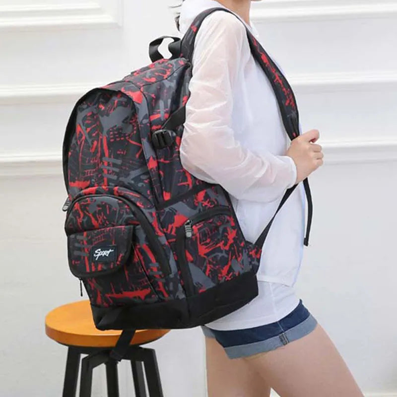 Blue classic nylon backpack with multiple pockets open, showing internal organisers and laptop sleeve.