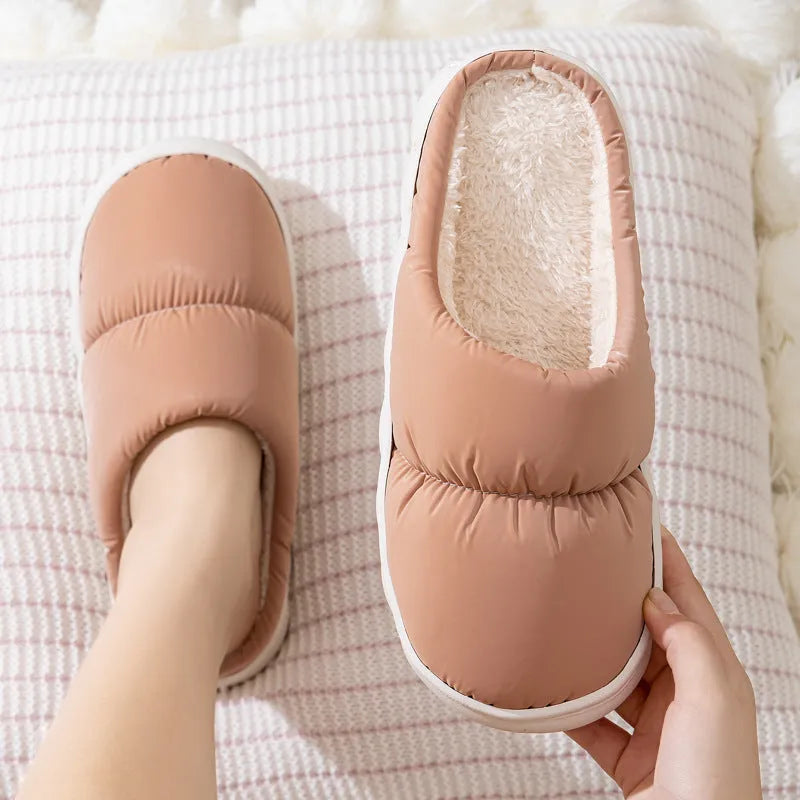 Blue down cotton slippers with thick rubber sole and plush lining, shown from side.