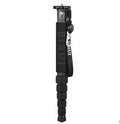 Black carbon fibre telescopic camera monopod fully extended to 1540mm next to an SLR