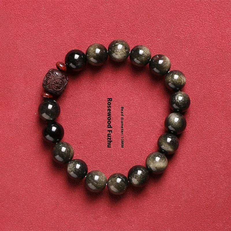 Golden obsidian vintage bracelet with hand-woven construction and national style design elements