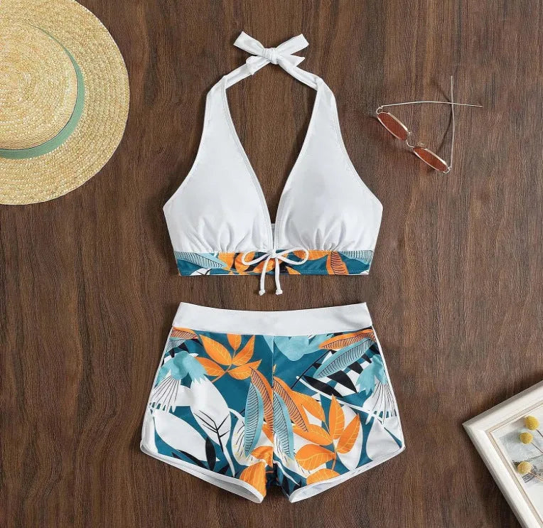 Women's solid colour white split top swimsuit with leaf print boxers bottoms, backless, sleeveless, polyester fabric