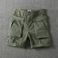 Men's straight-leg cargo shorts in stretch cotton fabric, shown in army green colour with multiple pockets.