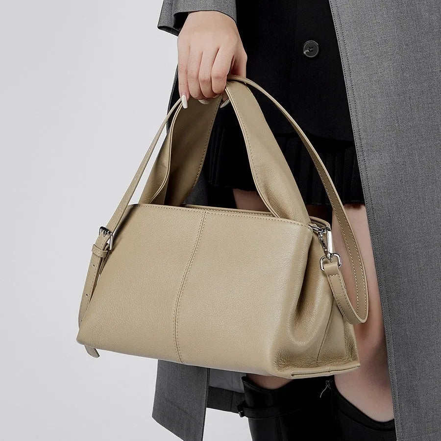 Genuine cowhide leather messenger bag in urban style with sandwich pocket and double straps.