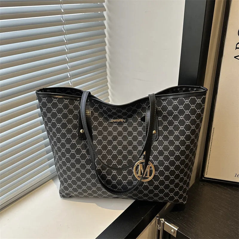 Western style black PU leather shoulder bag with adjustable strap and sewing thread detail.