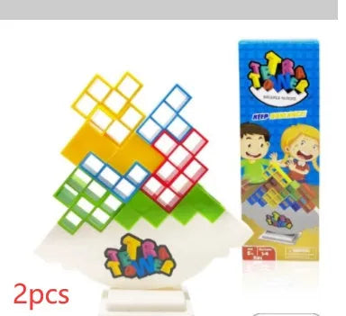 Plastic balance stacking board game with 16 colourful blocks, chassis, and base on a table.