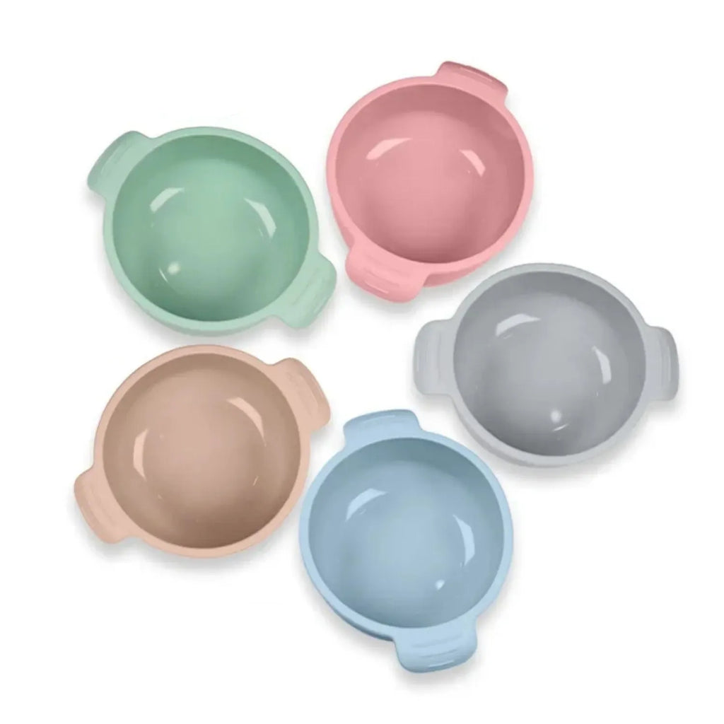 Silicone pet bowl with suction cups on a floor, shown in blue colour.