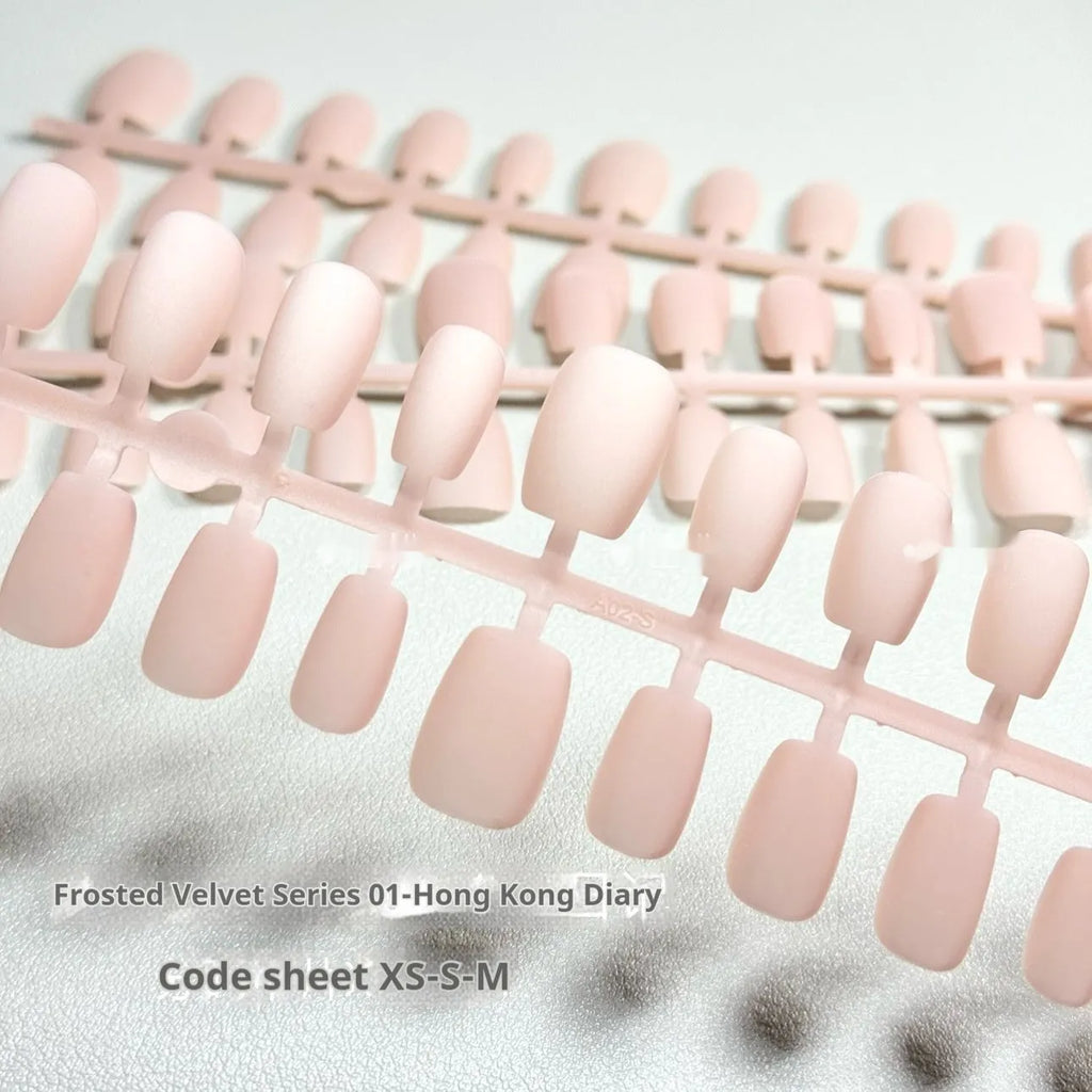 Frosted velvet Cat's Eye artificial nail set with Aurora shine on a short ladder PVC nail.