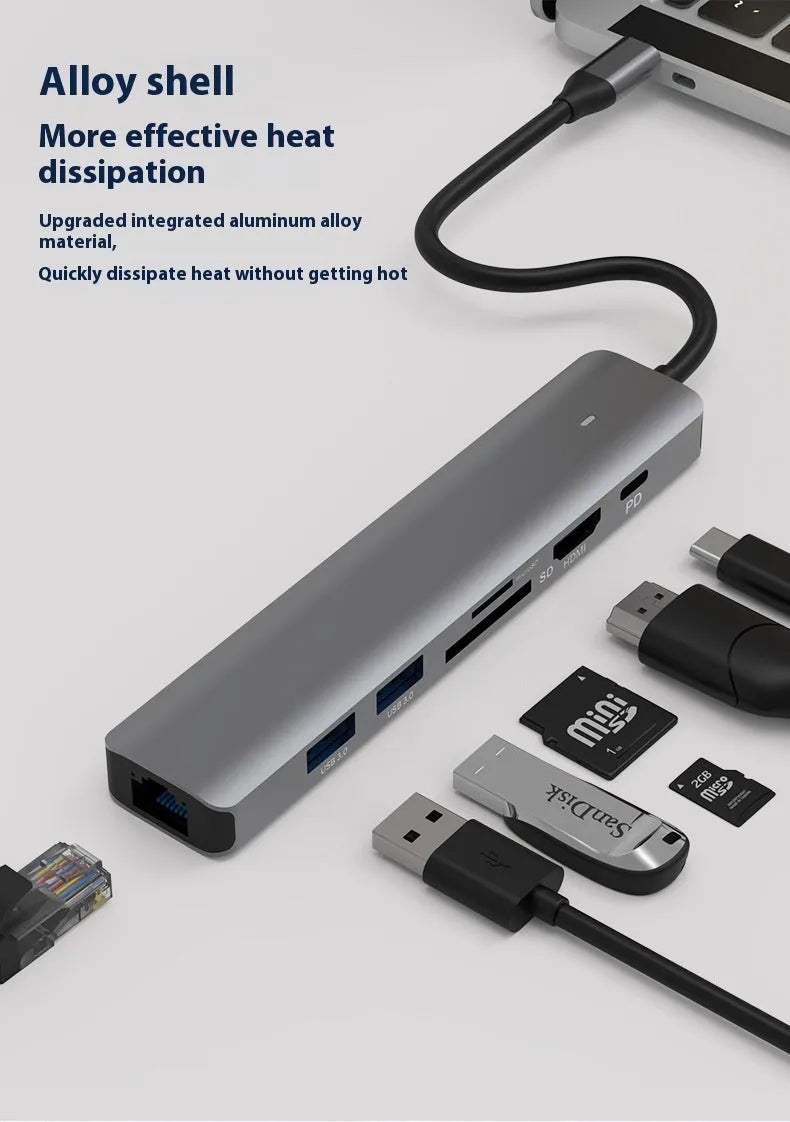 Silver 7-in-1 USB-C hub showing USB-C PD port, three USB ports, HDMI, and SD card slots.