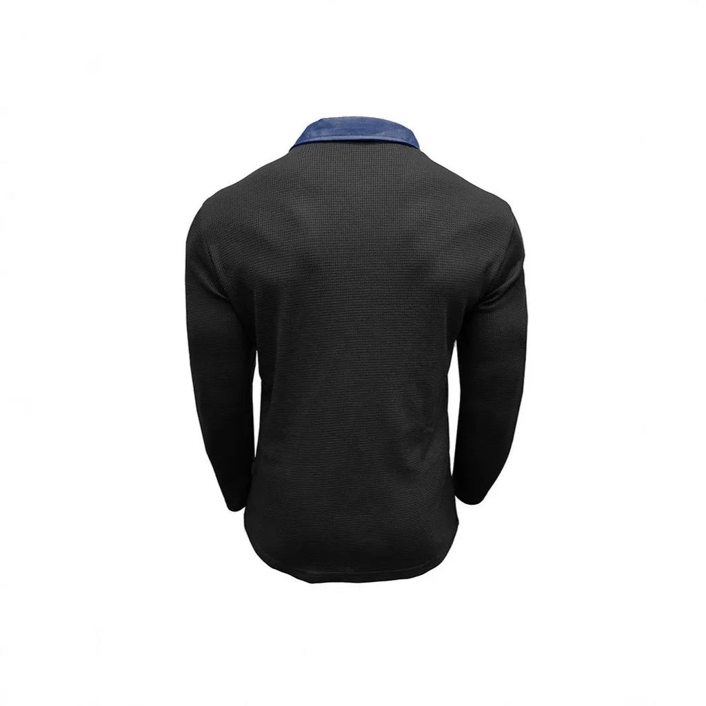 Man wearing a long-sleeved waffle-textured polo shirt in a loose fit, shown in a dark colour.