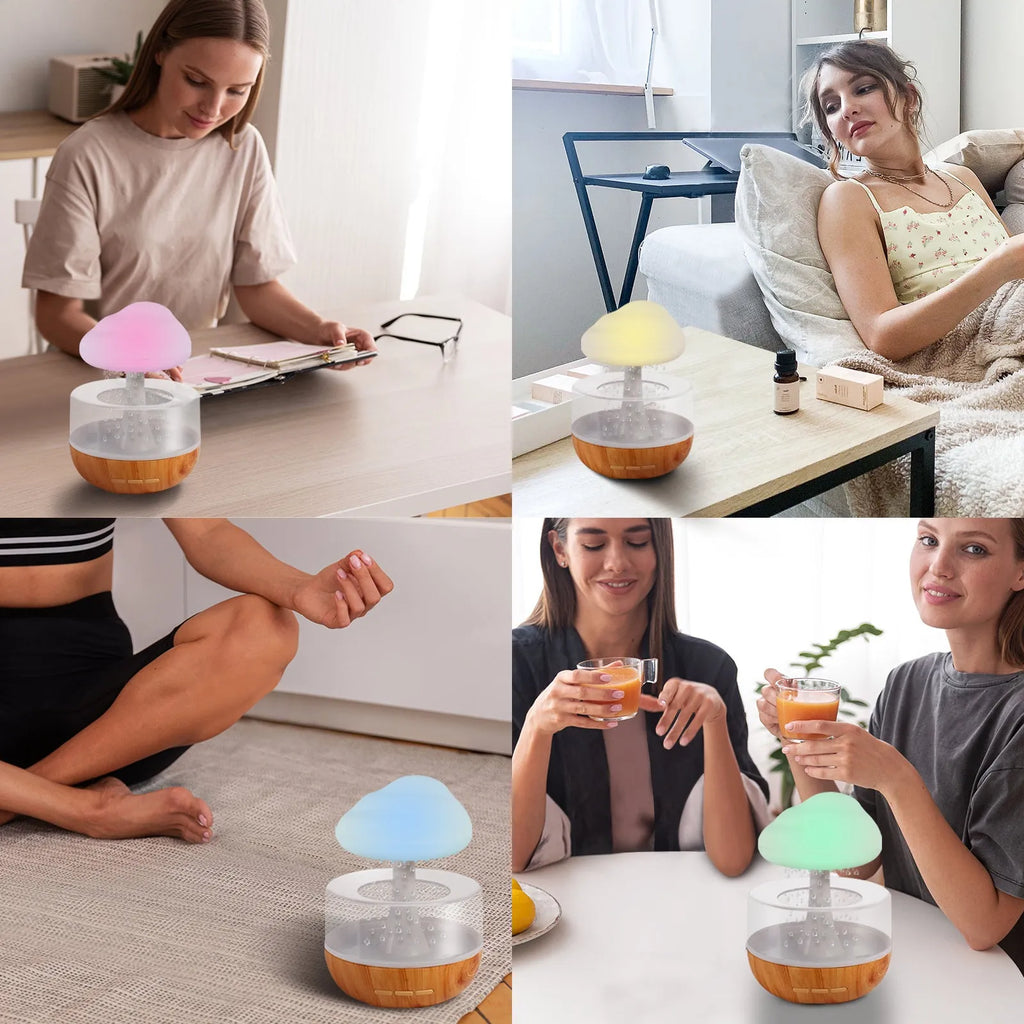 White cloud-shaped humidifier with multi-colour night light and essential oil diffuser on a table.