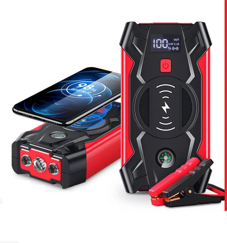 Red car emergency jump starter power pack with connection clips on a black background