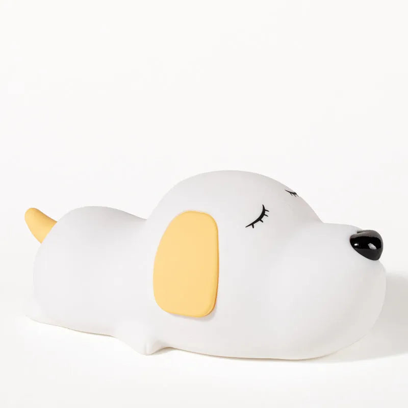 Cute two-tone cartoon dog silicone night lamp with USB cable for charging.