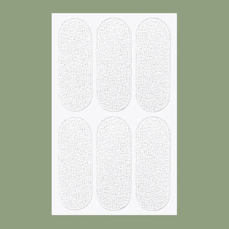 Transparent and frosted disposable TPU ear patch stickers on backing paper.