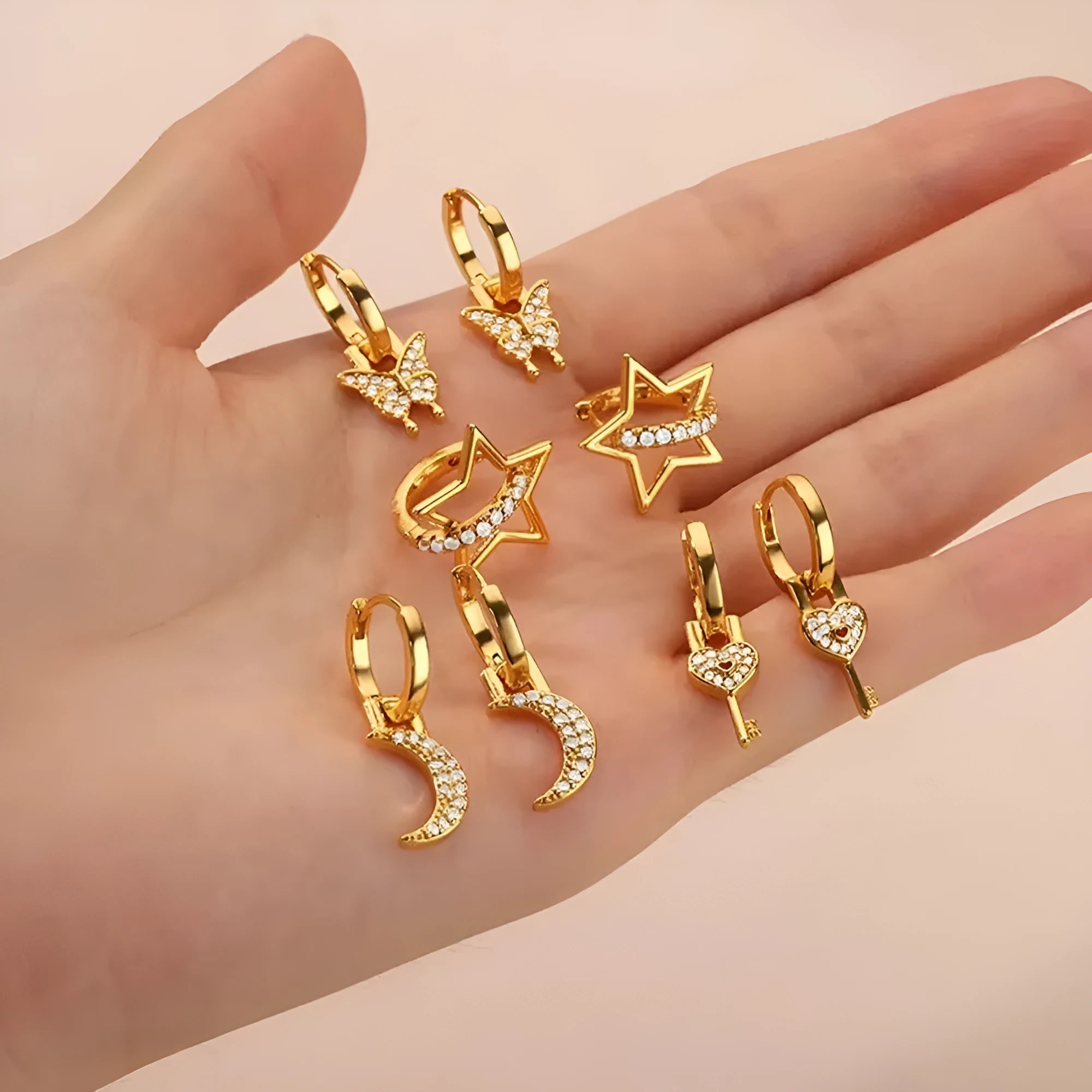 Women's copper butterfly earrings with geometric heart and star shapes.