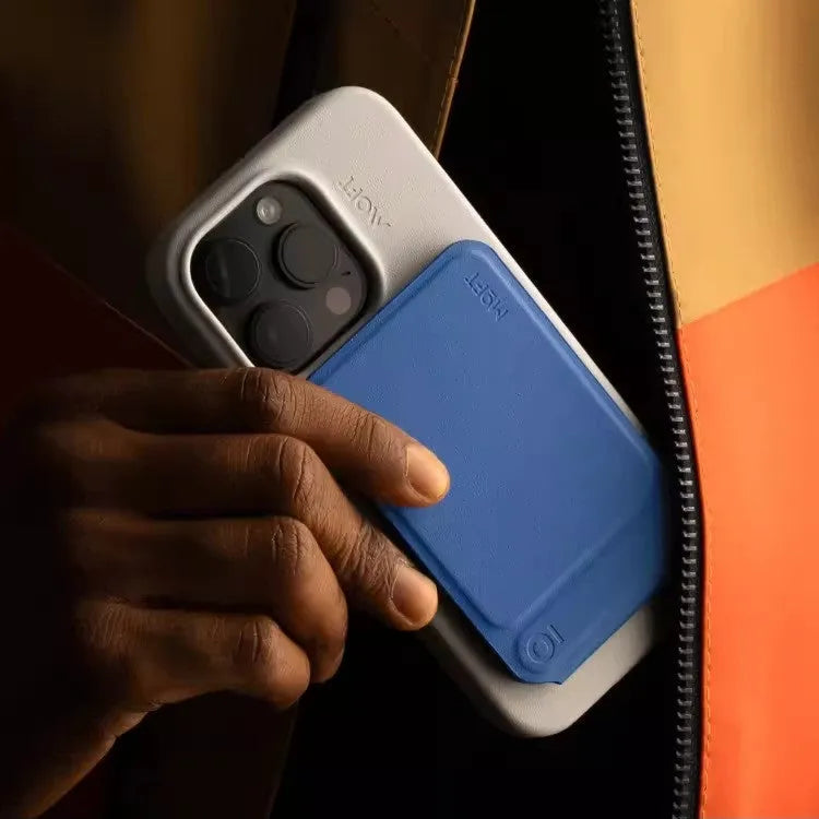 Slim black magnetic phone holder case with MOVAS leather texture on a magnetic car mount.
