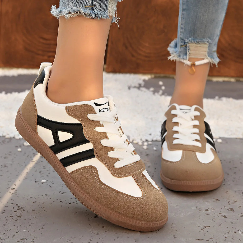 Women's low-top lace-up jogging shoes with a platform heel in khaki, grey, and black.