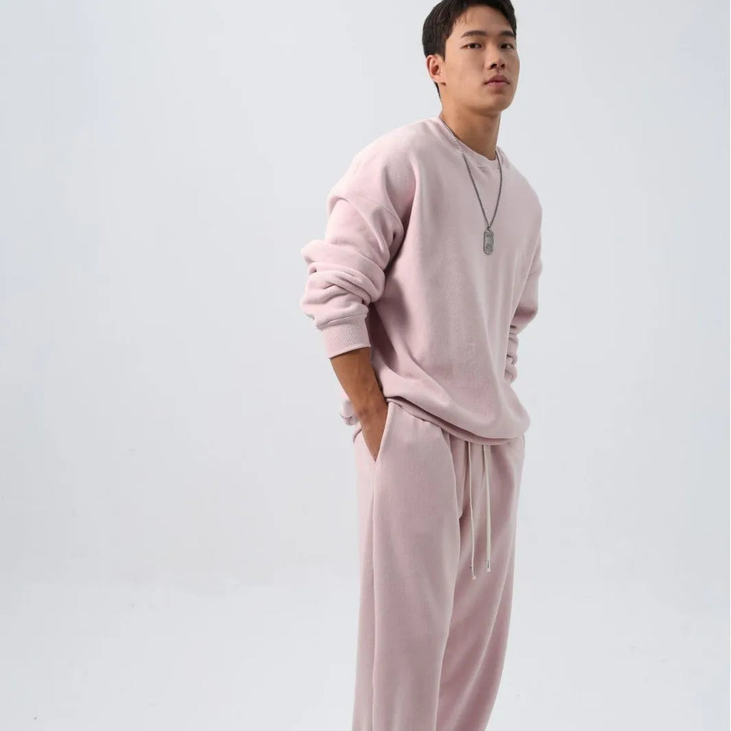 Men's polar fleece sports suit showing long-sleeved top and padded trousers in light grey colour
