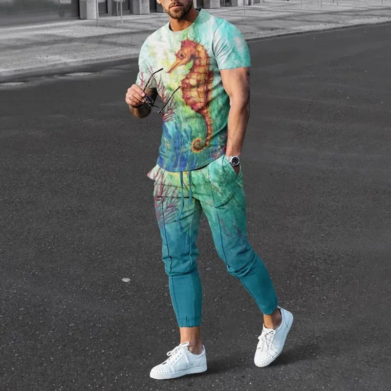 Man wearing a thin, short-sleeved printed pullover and matching trousers from a polyester blend sport suit set.