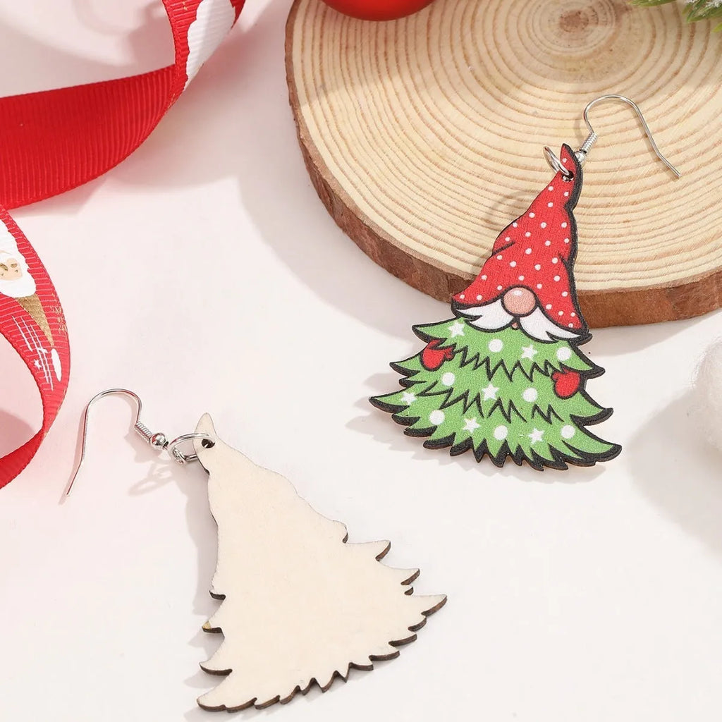 Wooden Christmas earrings with printed geometric designs featuring Christmas tree and snowman patterns