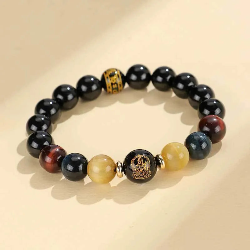 Manually crafted black agate beaded bracelet with gold, blue, and red tiger eye stones, showing ethnic zodiac design.