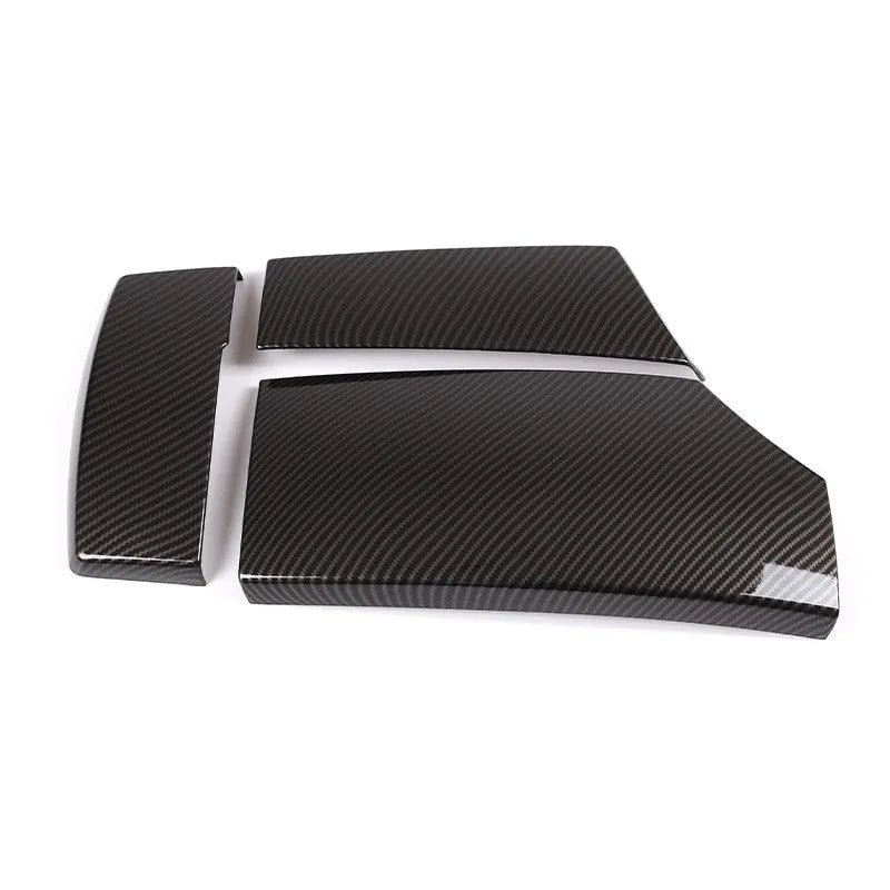 Three ABS carbon fibre pattern armrest box protective covers showing diagonal weave and shiny surface