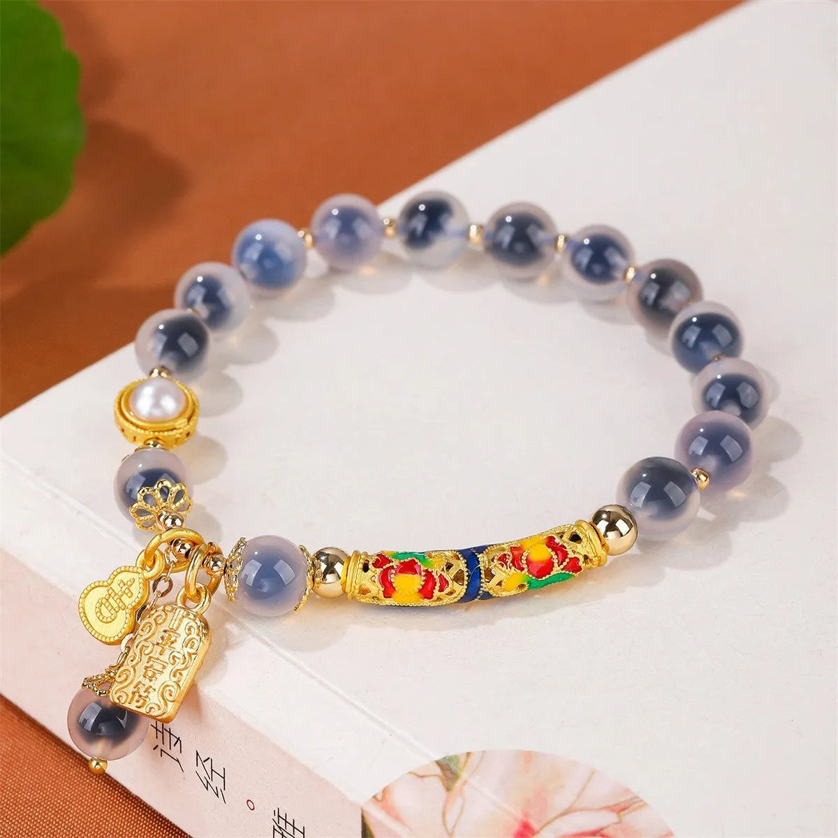 Handmade sugar heart agate bracelet in retro ethnic style with cherry blossom, peach blossom, and ping an pendant designs.