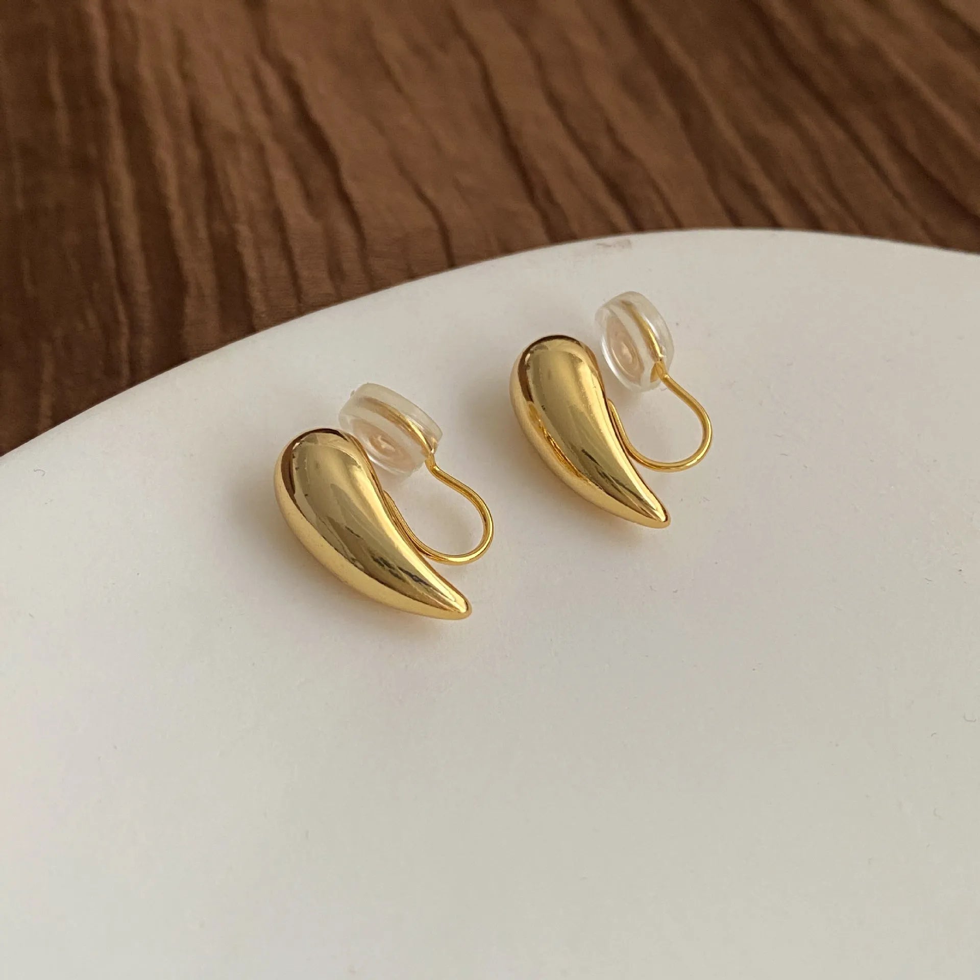 Geometric copper droplet earrings for women with electroplated finish, available as ear clips or studs