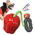 Green plastic dog molar toy with a built-in food-dropping ball on a white background.