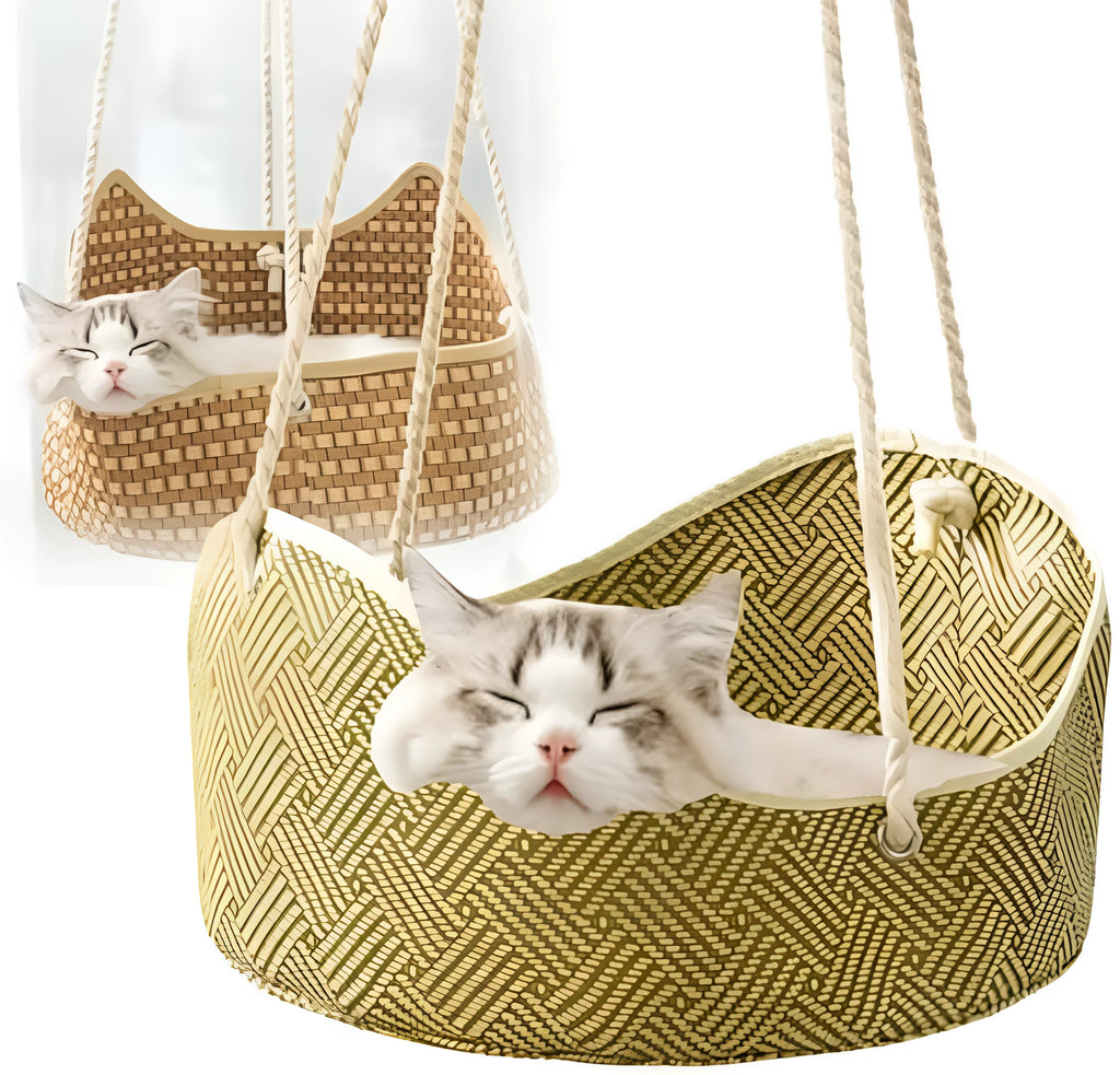 Green rattan cat hammock with metal hooks hanging on a white cage.